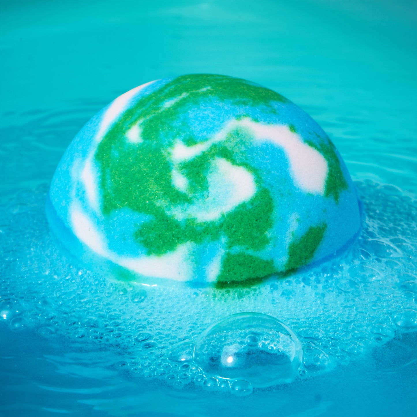 blue earth bomb fizzing in blue water