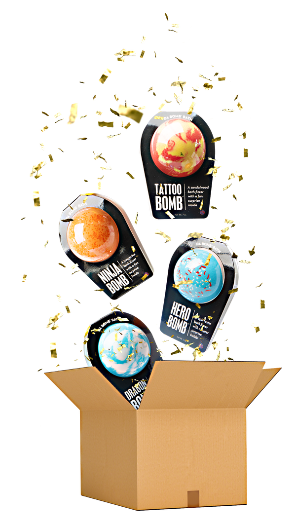 4 black bath bombs floating out of box with confetti