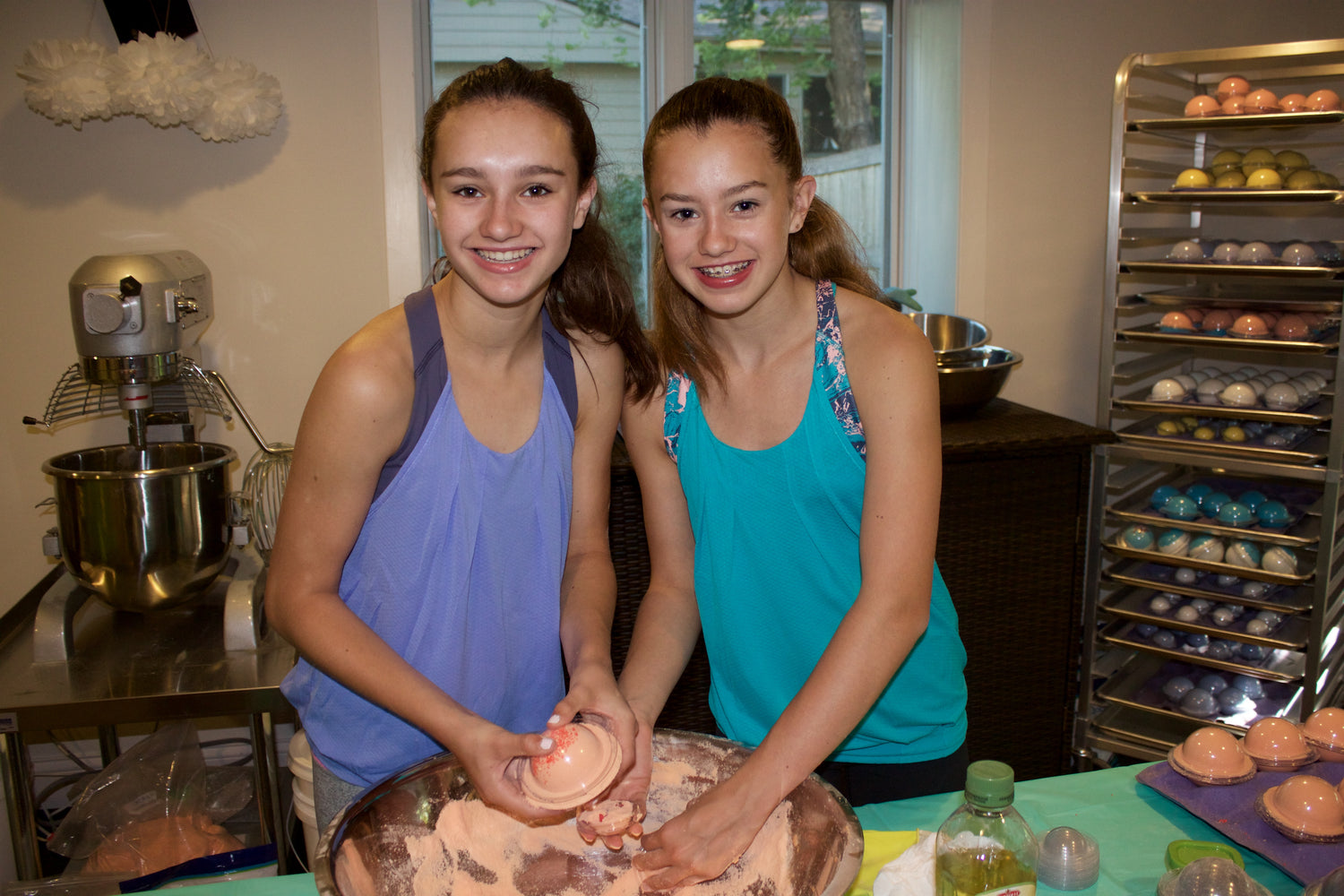 two young girls making bath bombs