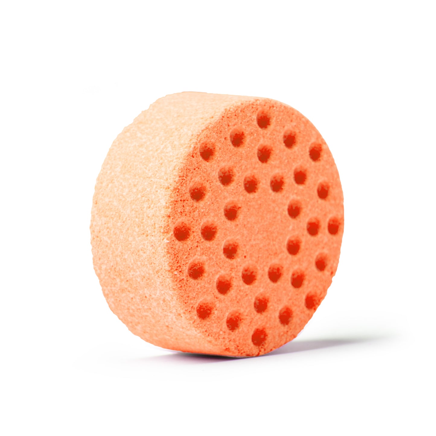 an orange shower steamer on white background, slight angle with shadow