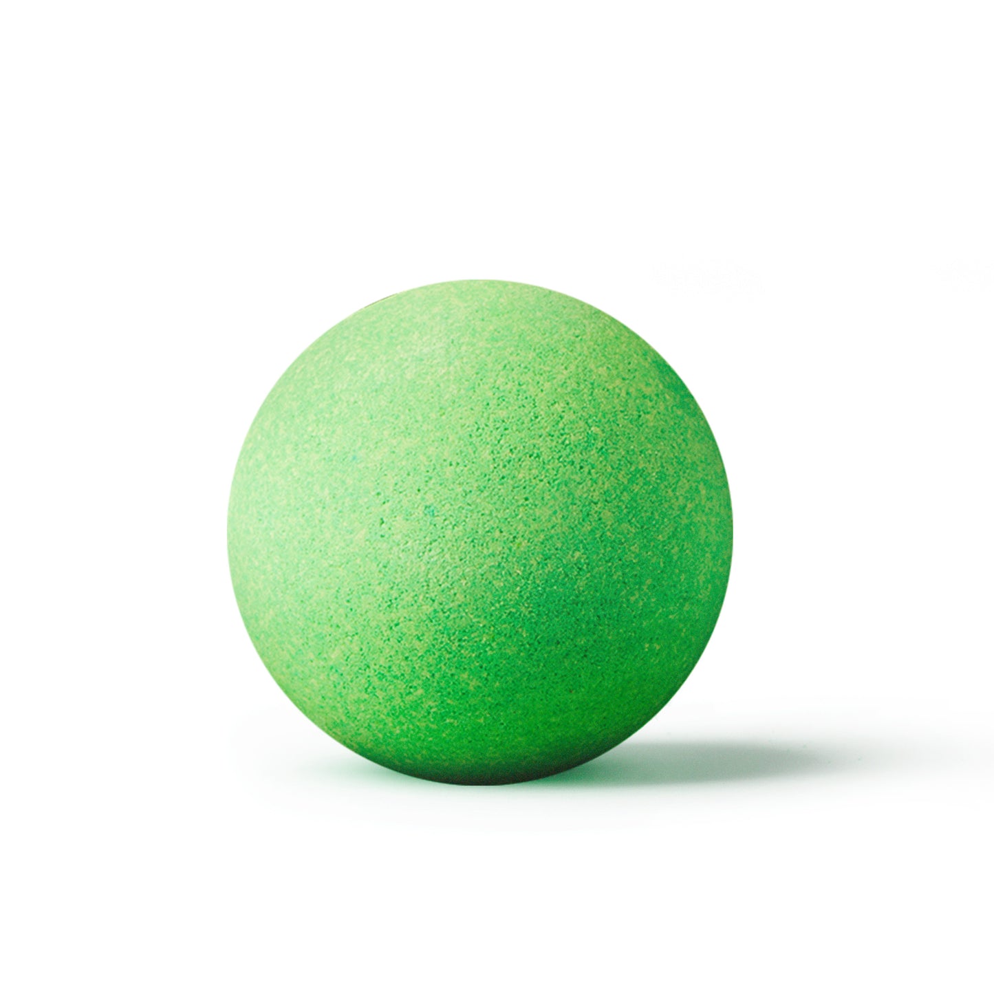 a green bath bomb with shadow