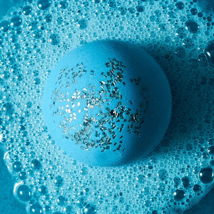 blue bling bath with sprinkles fizzing in water