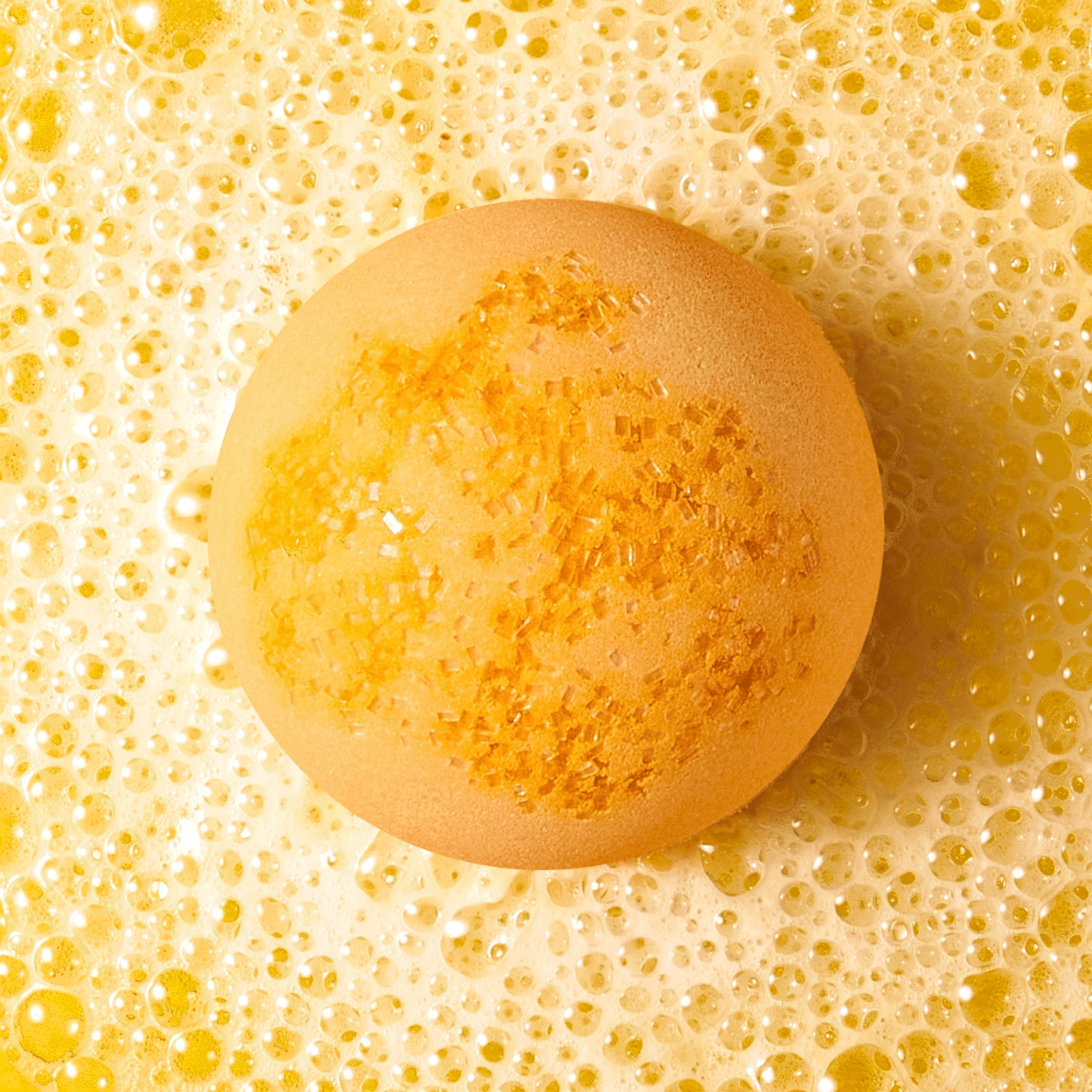 orange bath bomb fizzing in water