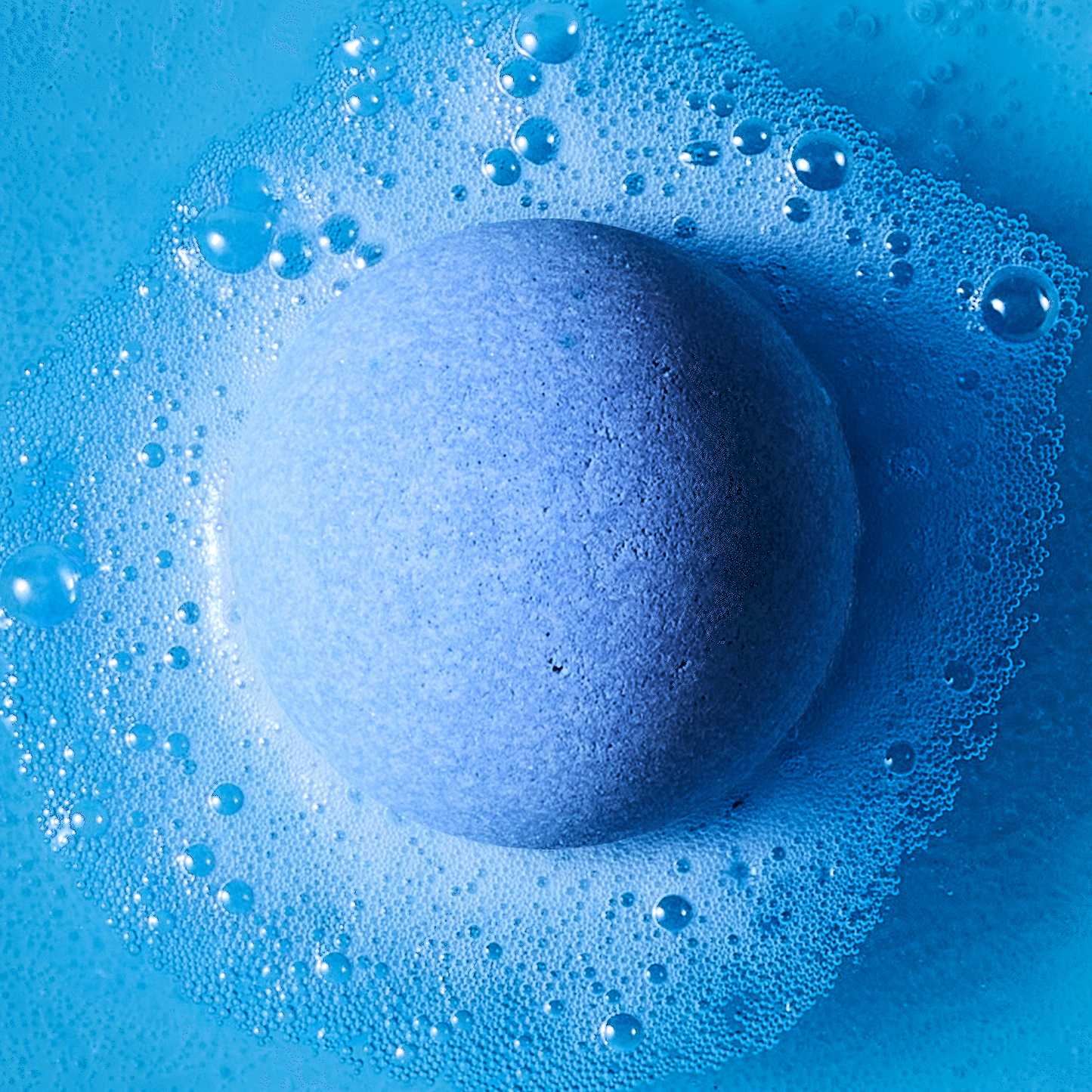 blue bath bomb fizzing in water
