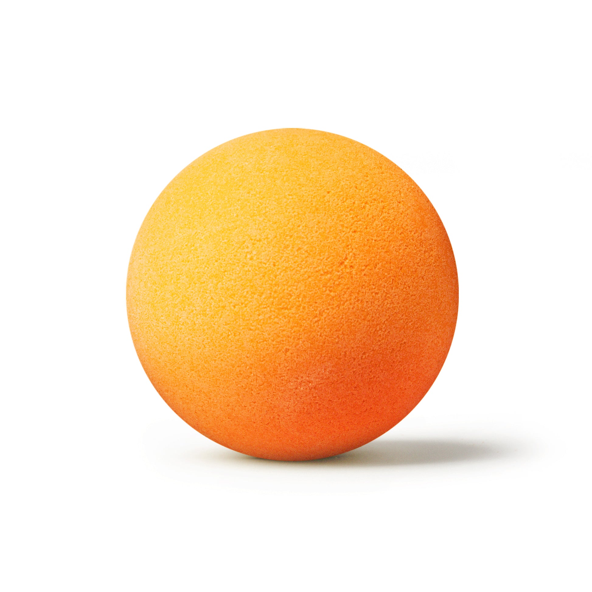 an orange bath bomb with shadow