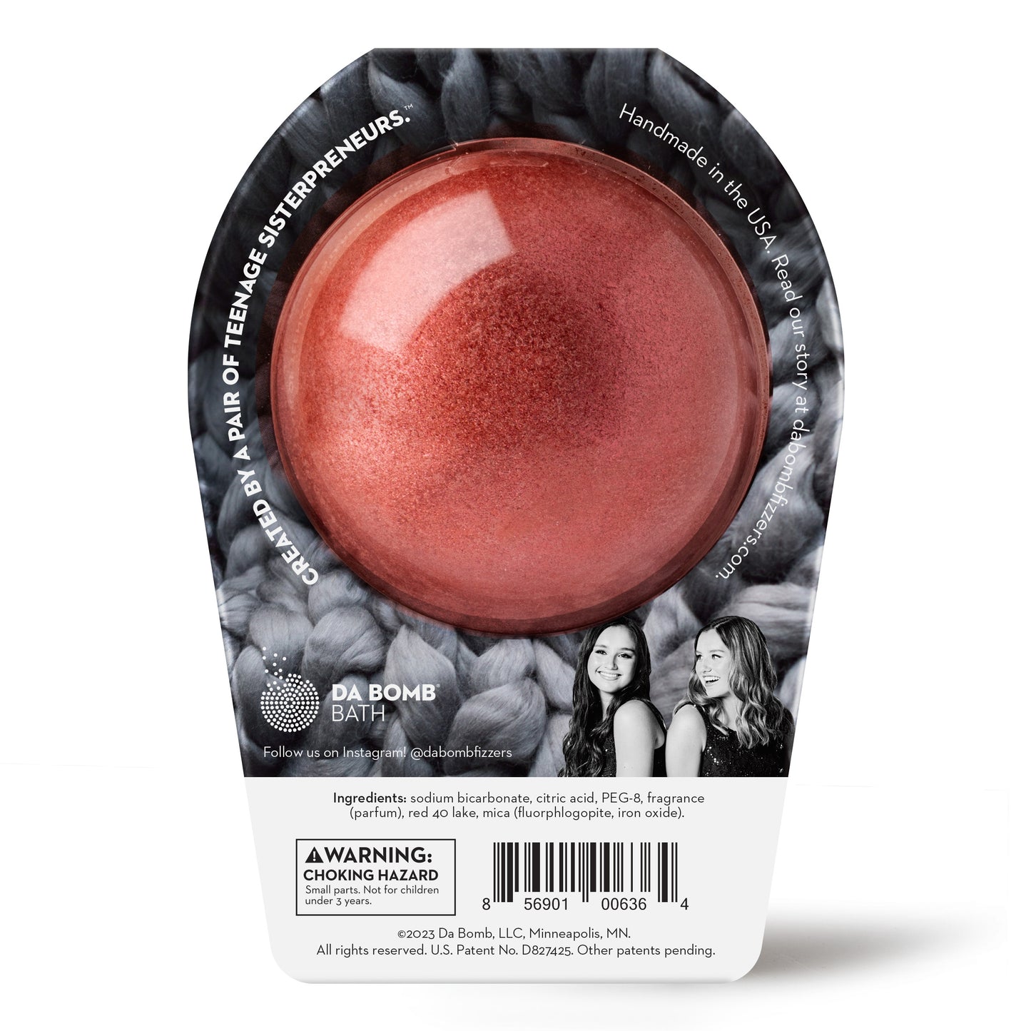 back of a crimson glitter bath bomb with grey knitted graphic packaging