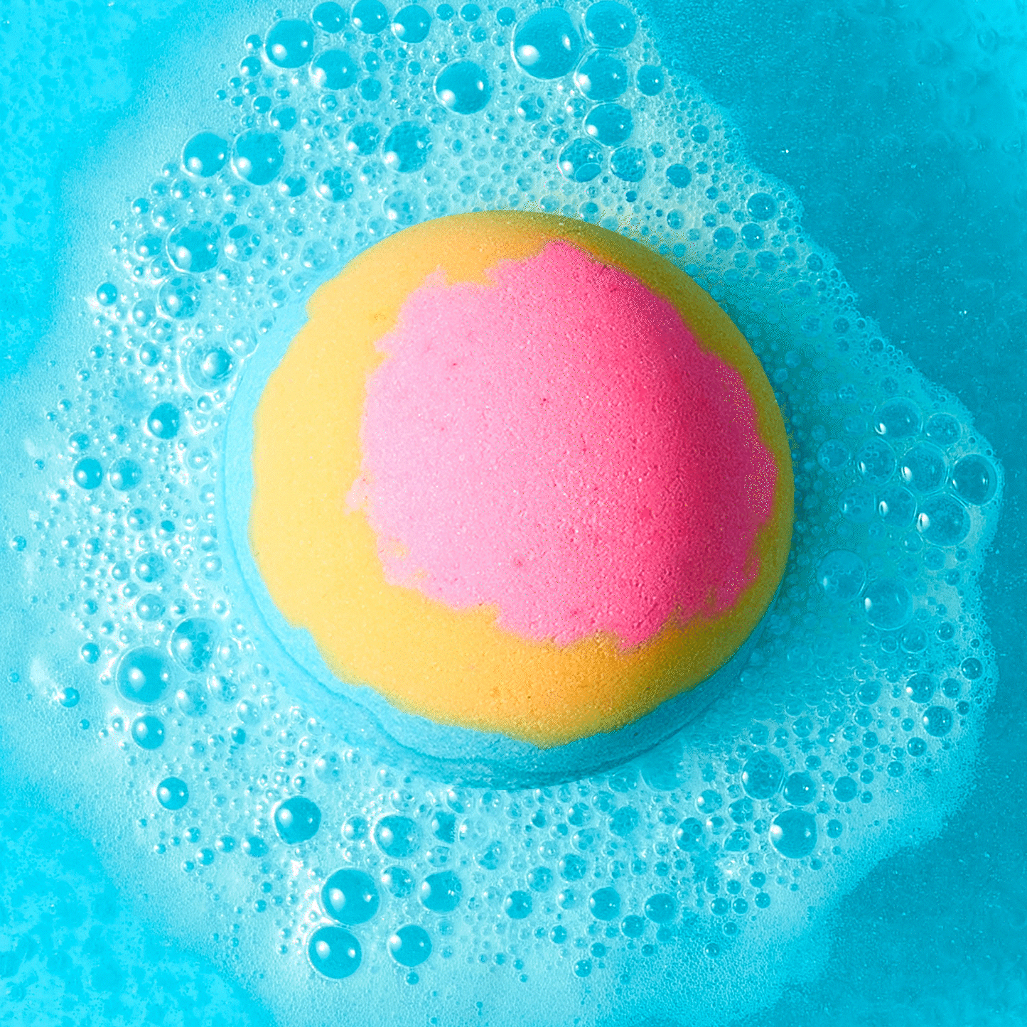 animated gif of flower bath bomb fizzing in water