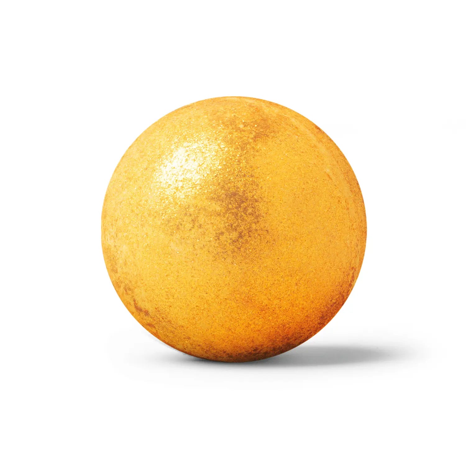 golden bath bomb on white background with shadow