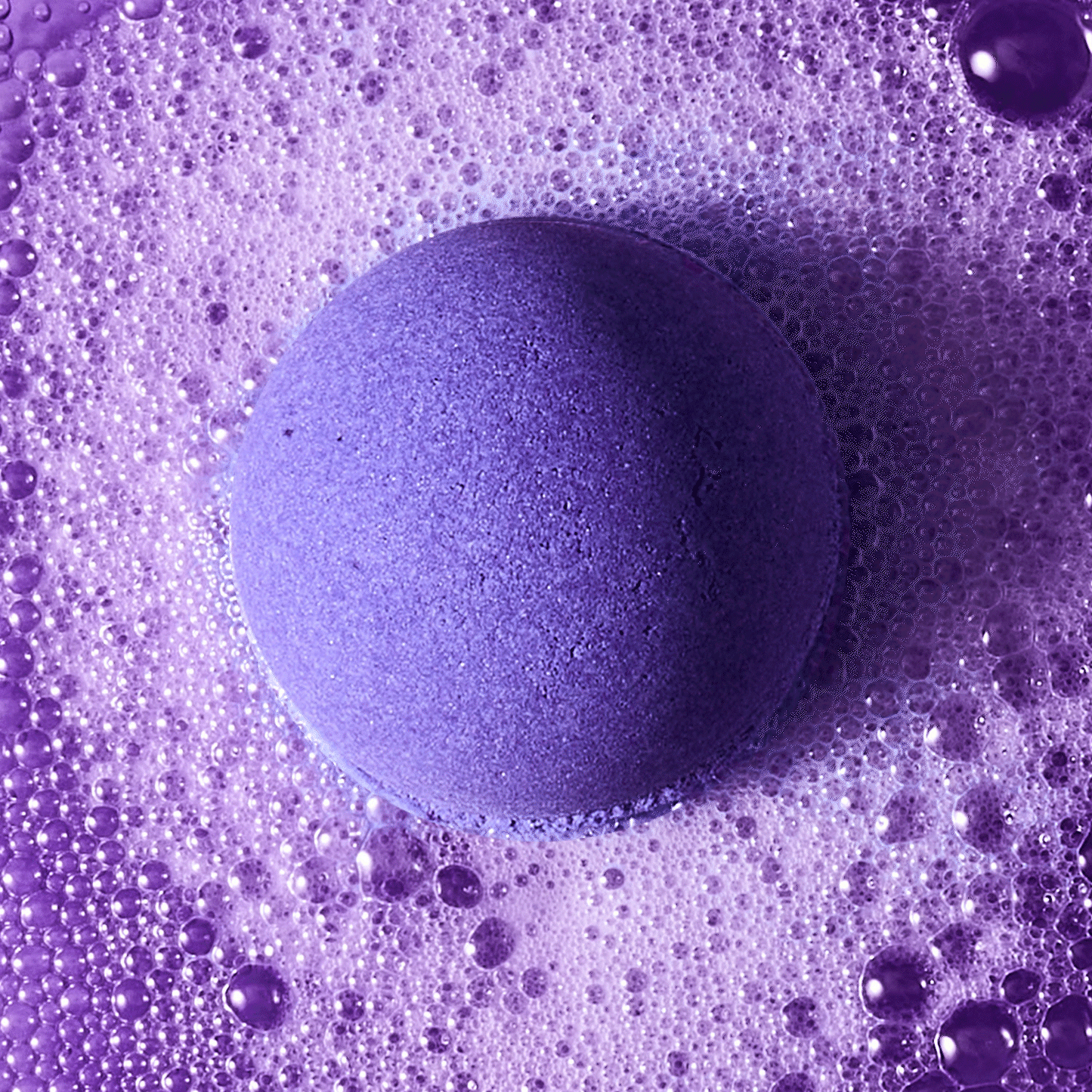 purple barbie bath bomb fizzing in water