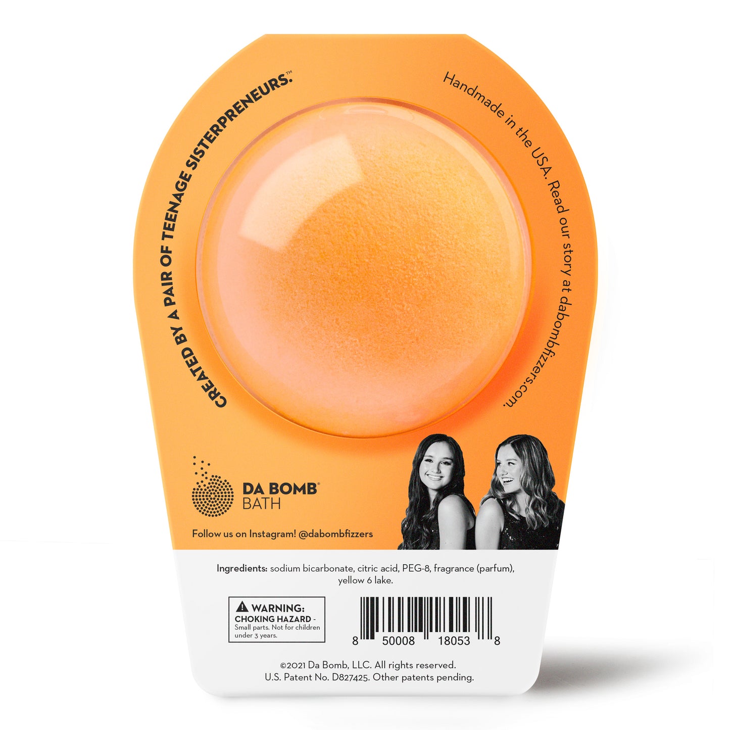 back of an orange bath bomb in orange packaging 