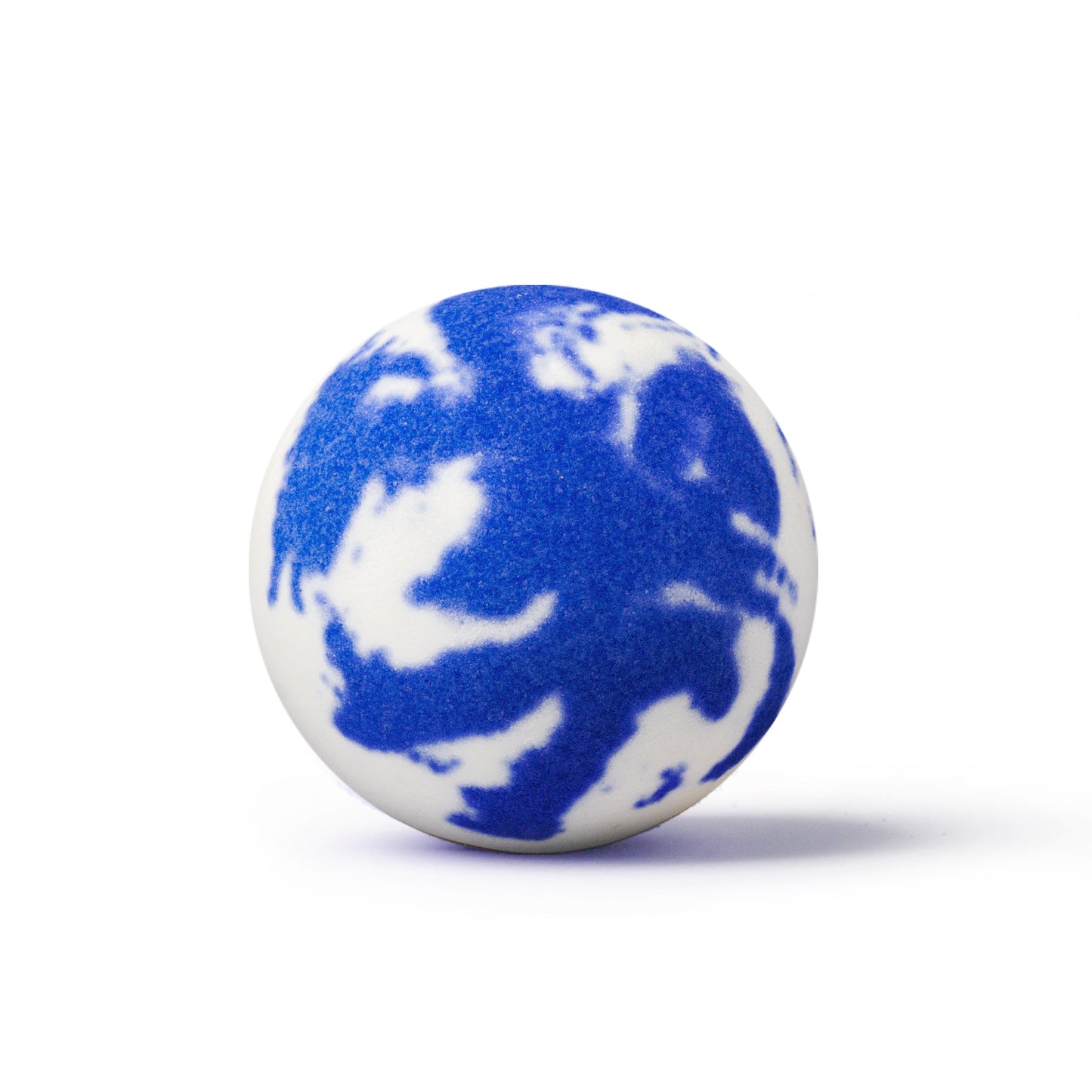 a purple and white bath bomb on white background with shadow