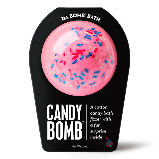 a pink bath bomb with sprinkles in black packaging
