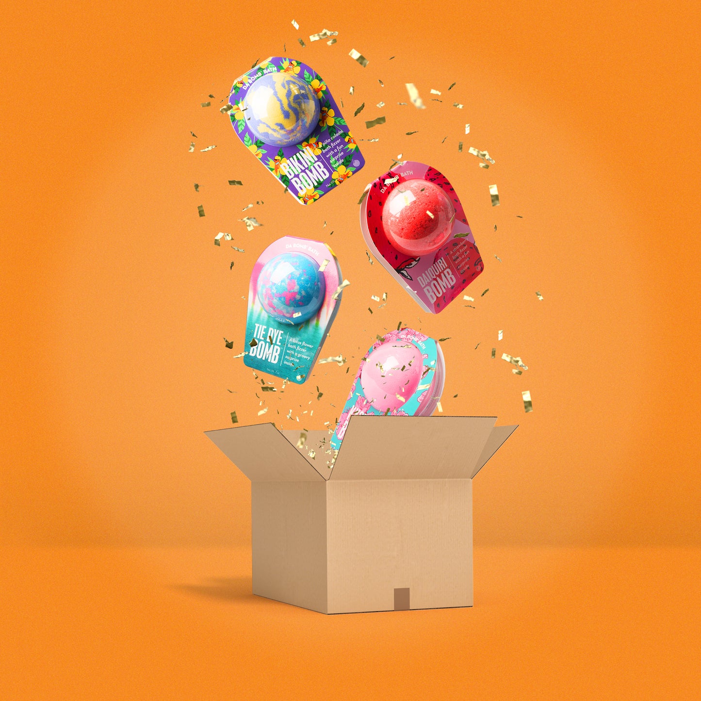 Purple, red, blue, and pink bath bombs falling into a cardboard box on an orange background with yellow confetti