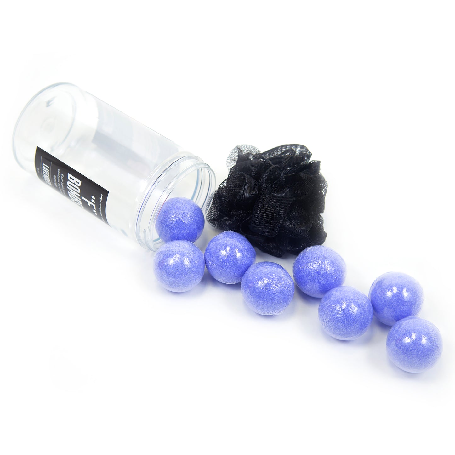 Clear jar with mini purple bath bombs spilling out of it onto a white background.