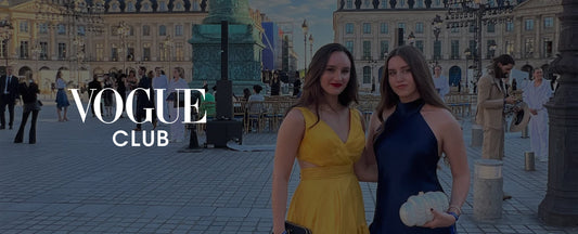 Two girls dressed up at paris fashion week with white vogue club logo 