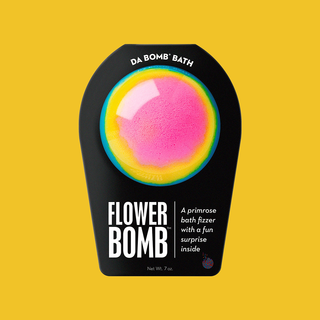 a pink, yellow, and blue bath bomb on a yellow background