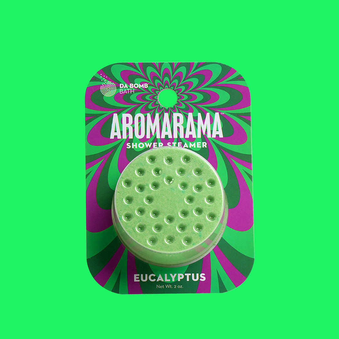a green shower steamer in psychedelic packing on a green background