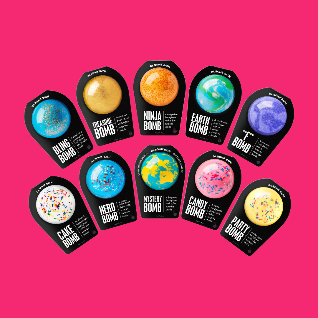 10 black packaged bath bombs on redish pink background