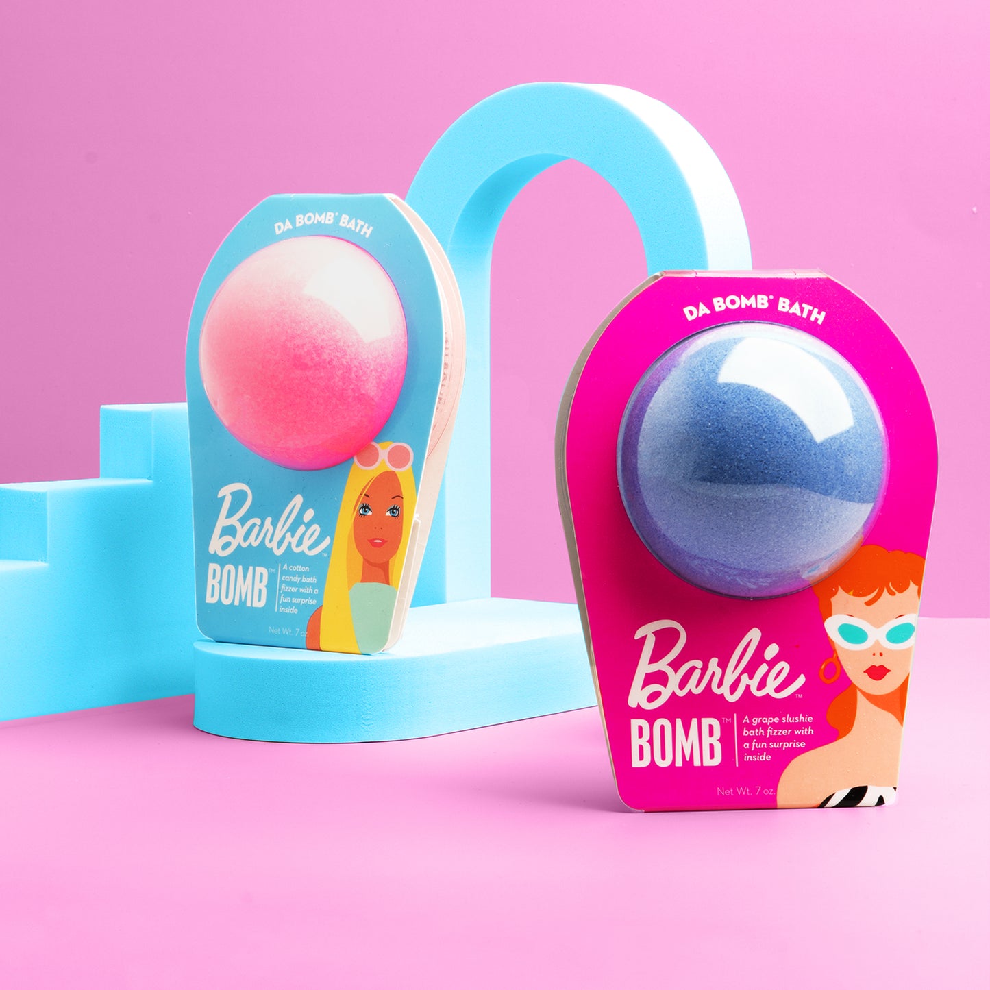 a pink and purple barbie bath bomb with blue arches