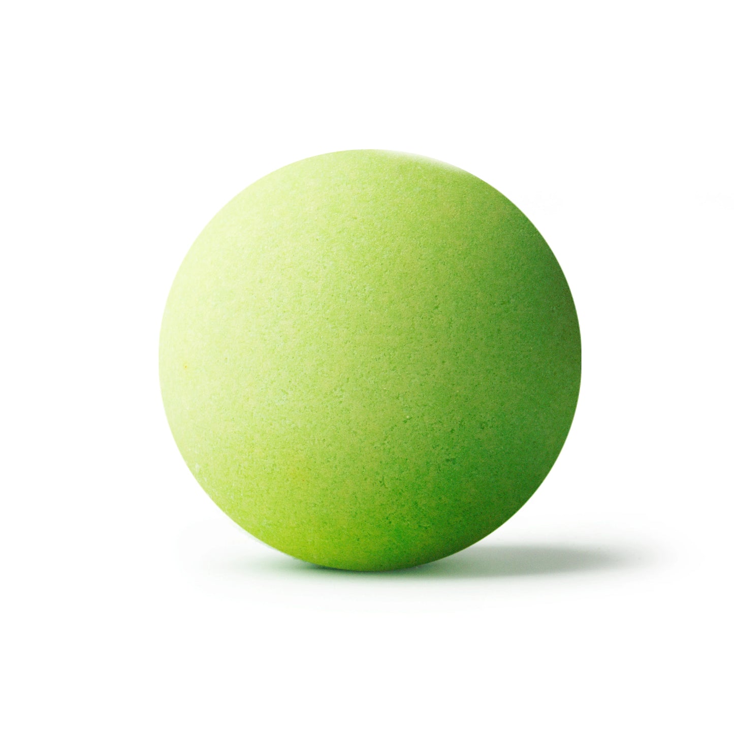 A green bath bomb on a white background