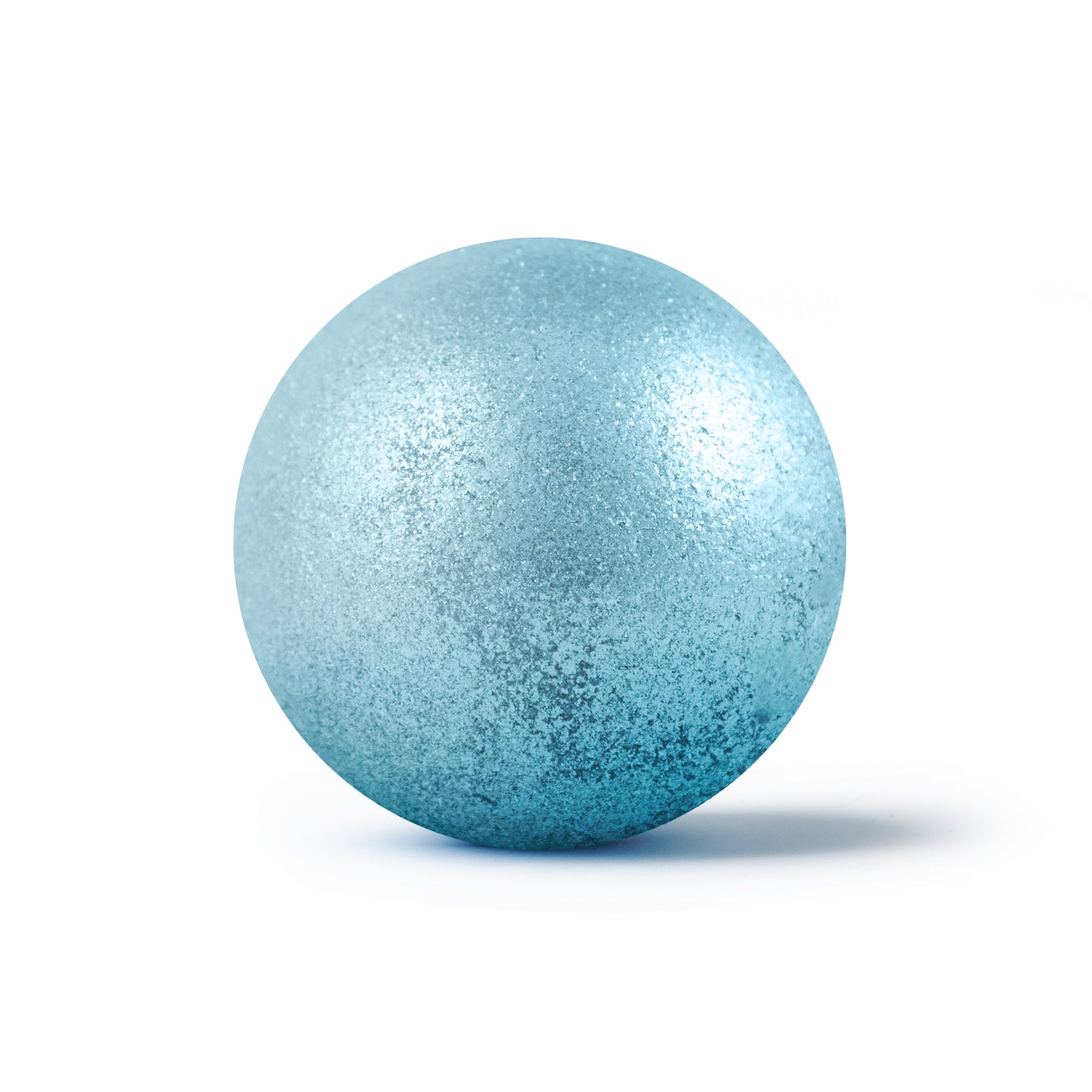 Sparkly light blue round bath bomb out of packaging on white background.