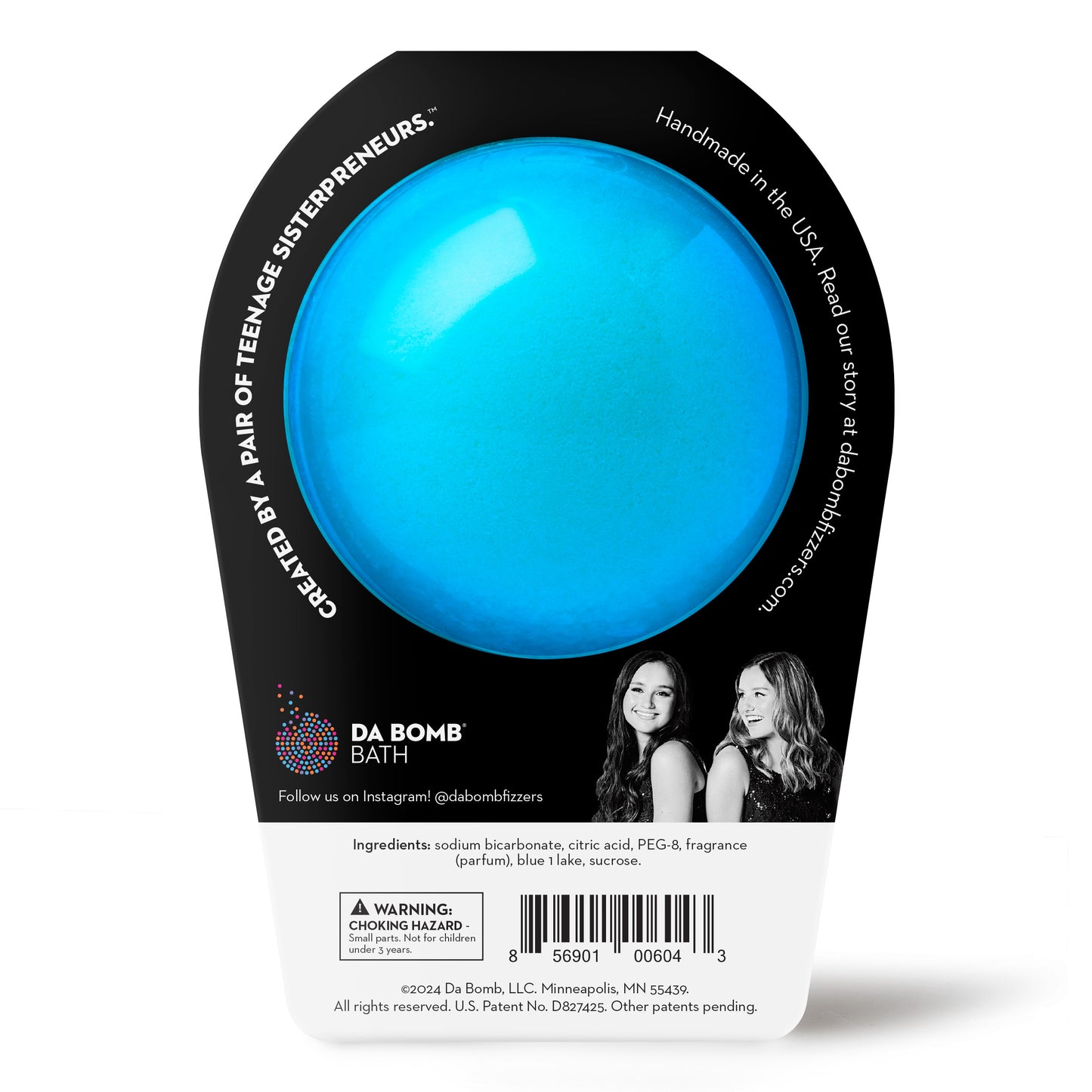 a blue bath bomb with silver sprinkles in black packaging