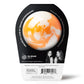 back of an orange and white bath bomb in black and white packaging