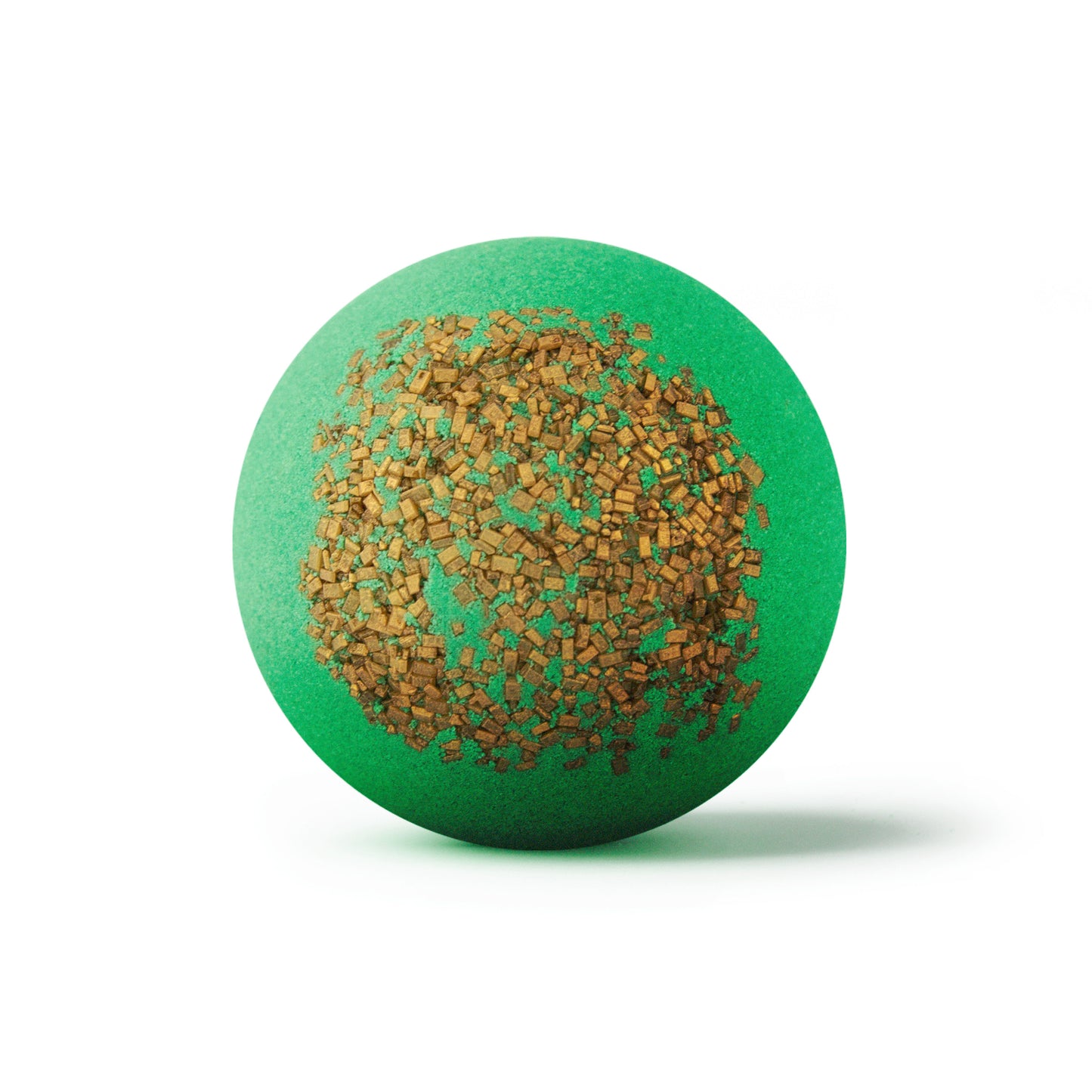 a green bath bomb with golden sprinkles