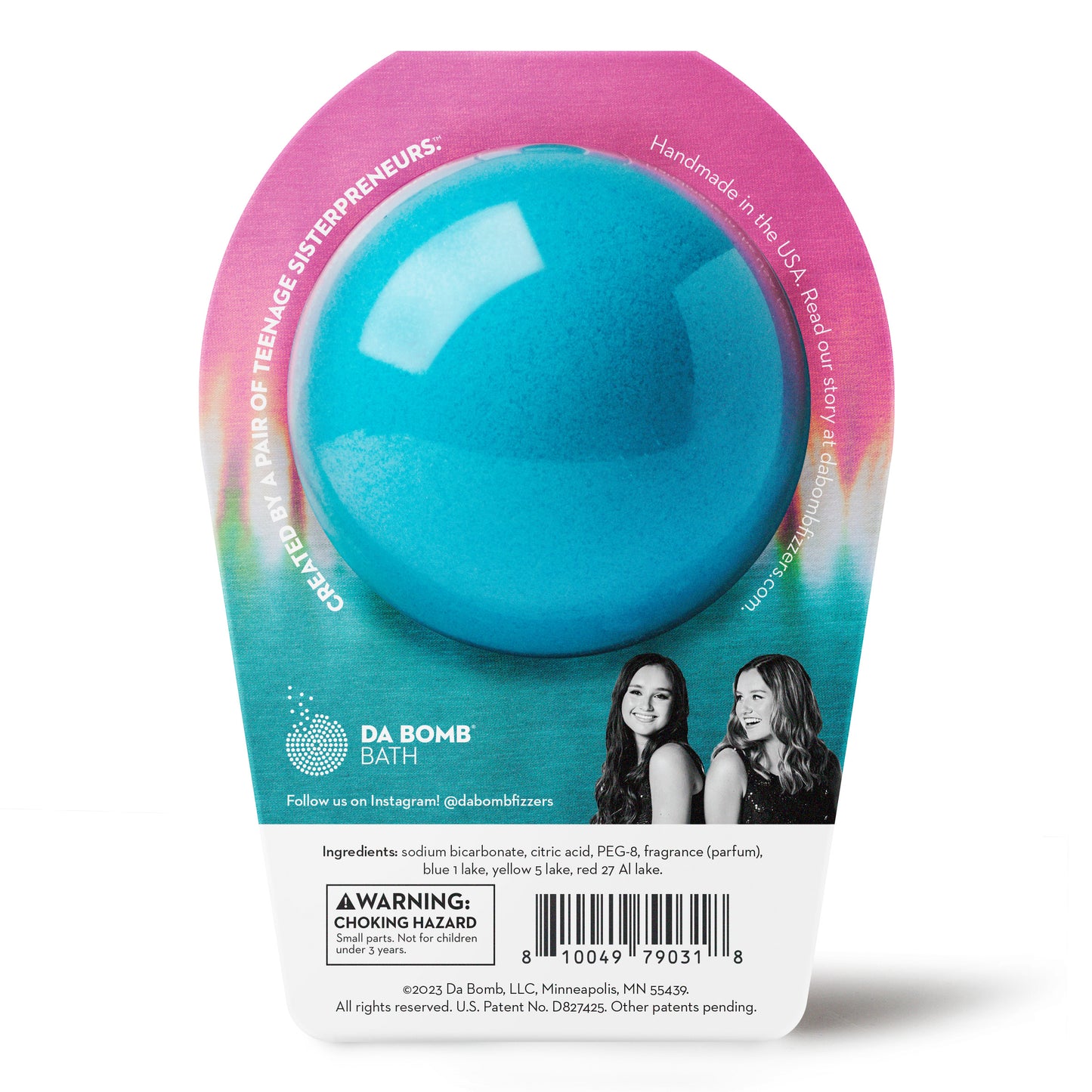 back of a blue bath bomb with pink spots in tie dye packaging