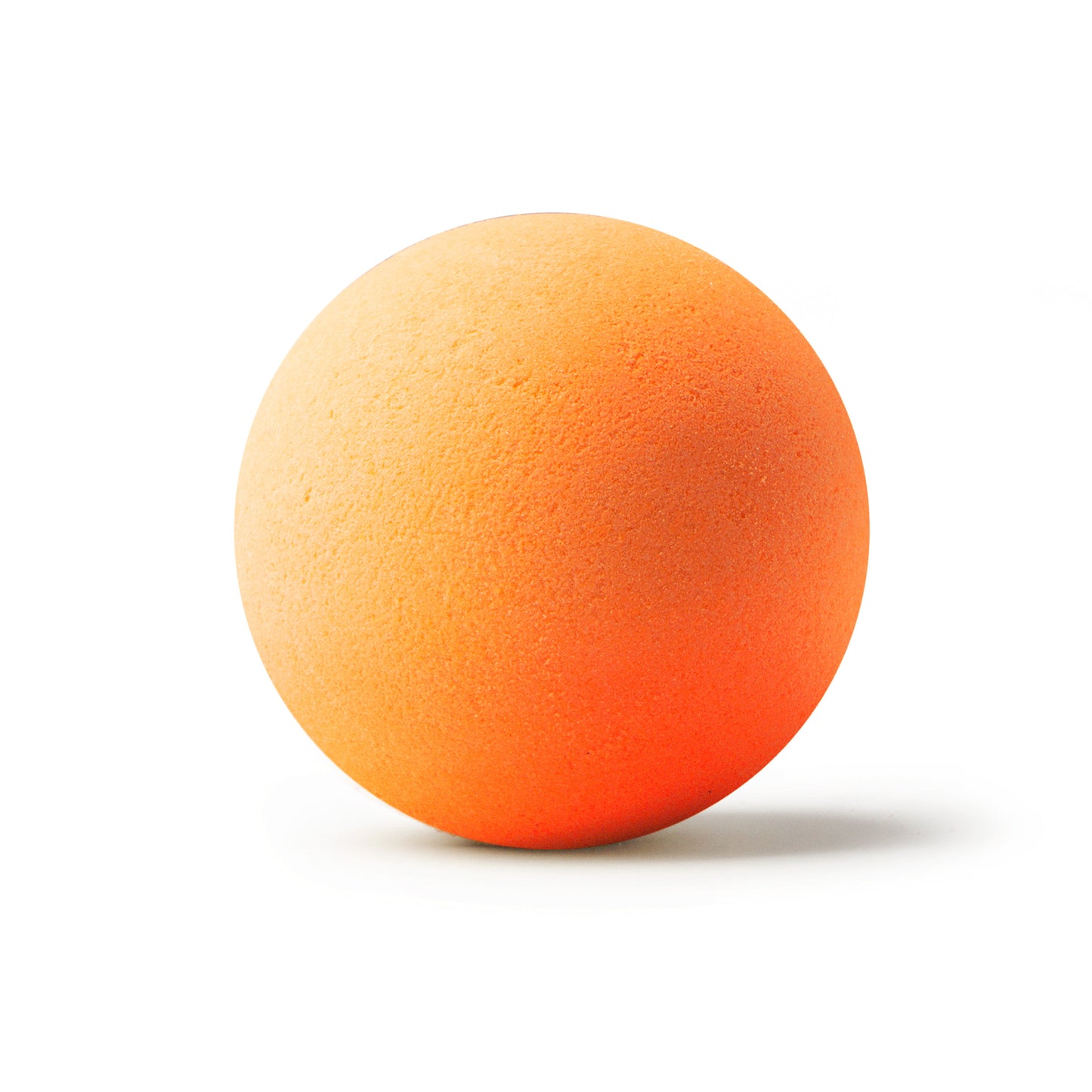 an orange bath bomb with shadow