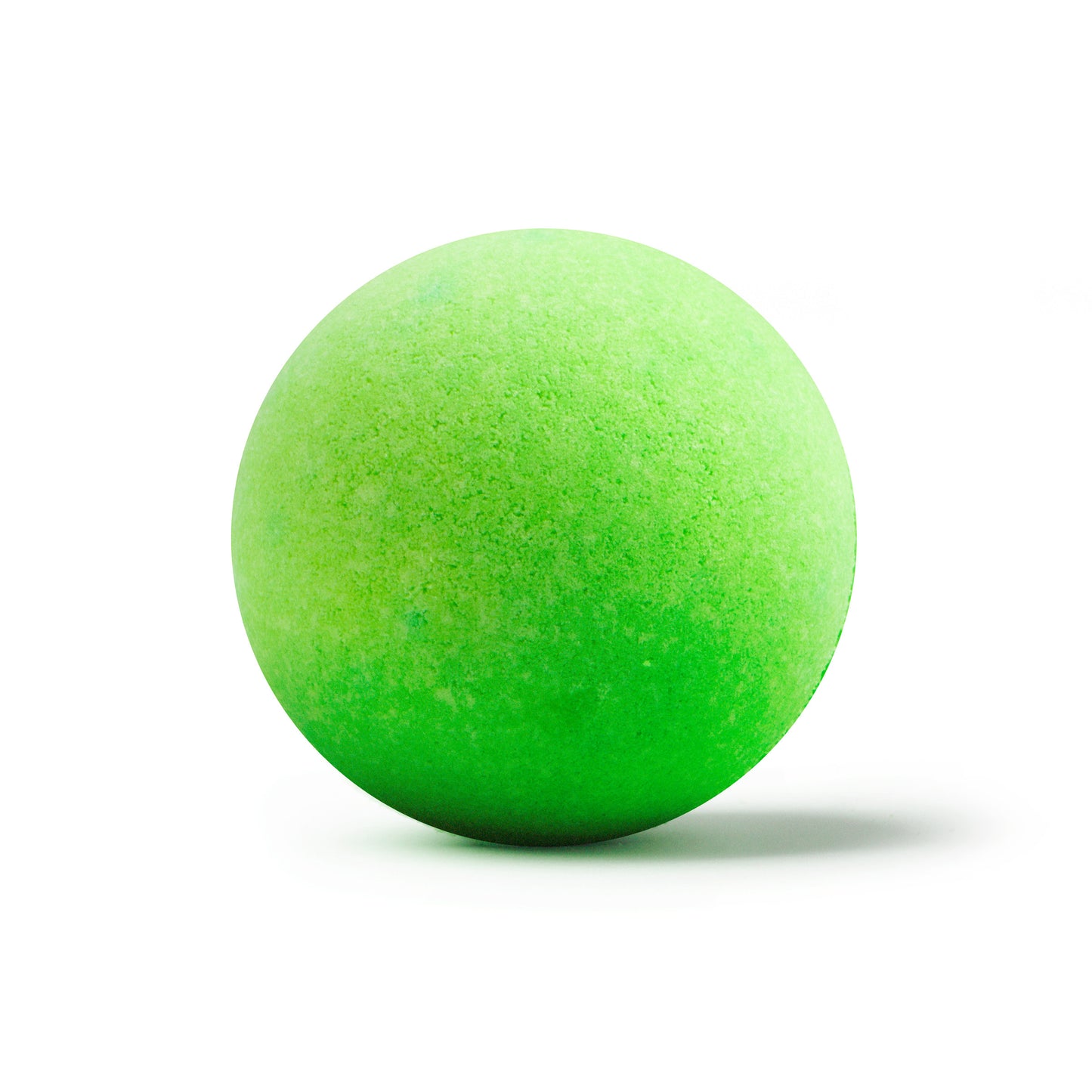 a bright green bath bomb with shadow