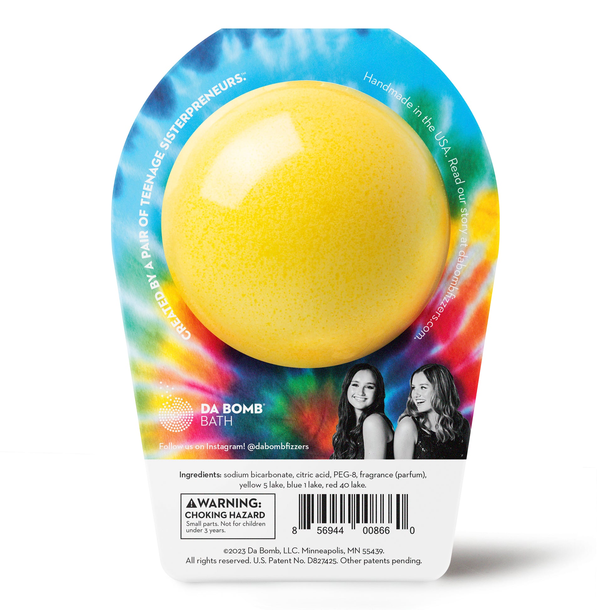 back of a yellow bath bomb with red and blue dots in tie dye colored packaging 