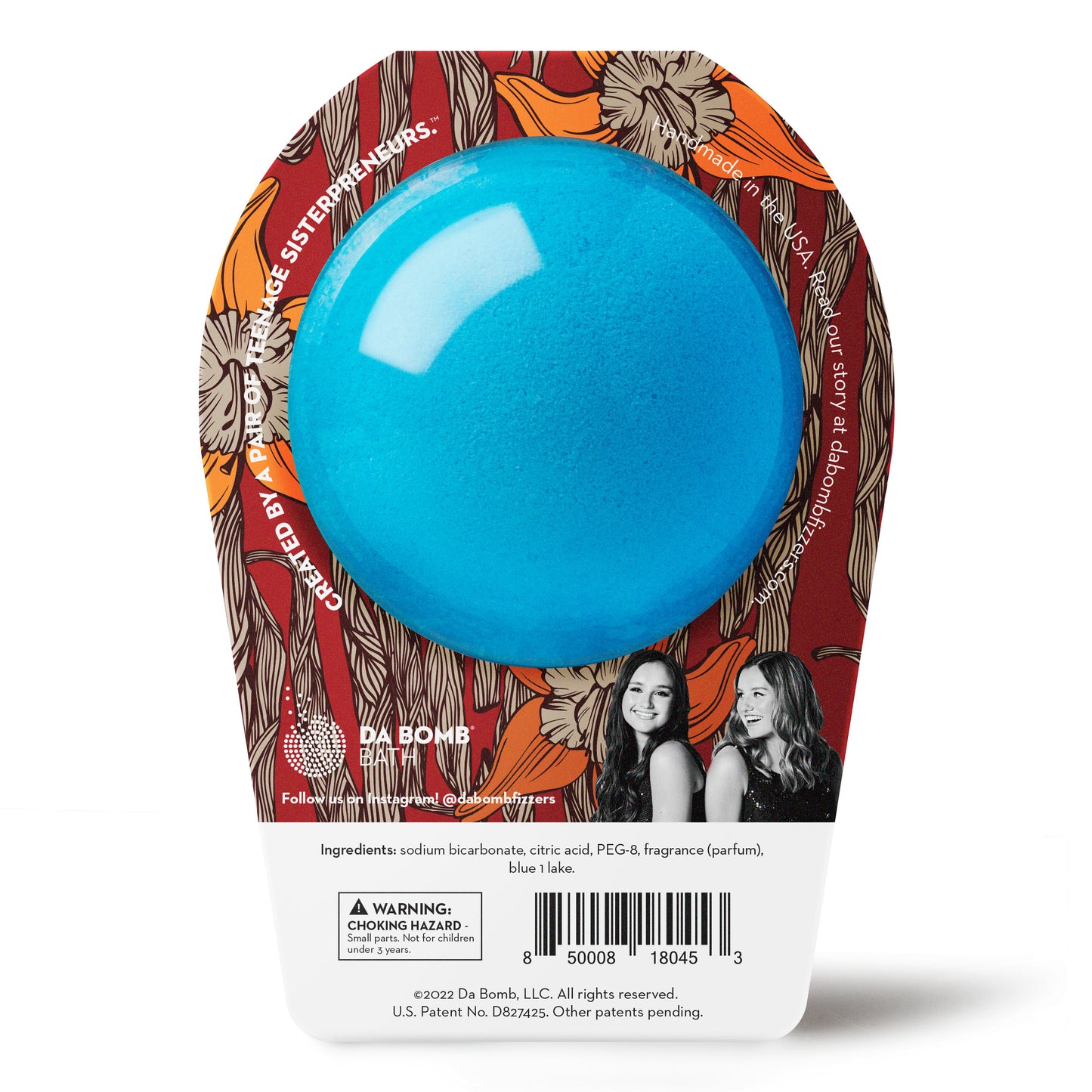 back of a blue bath bomb in dark red packaging with illustrated flowers