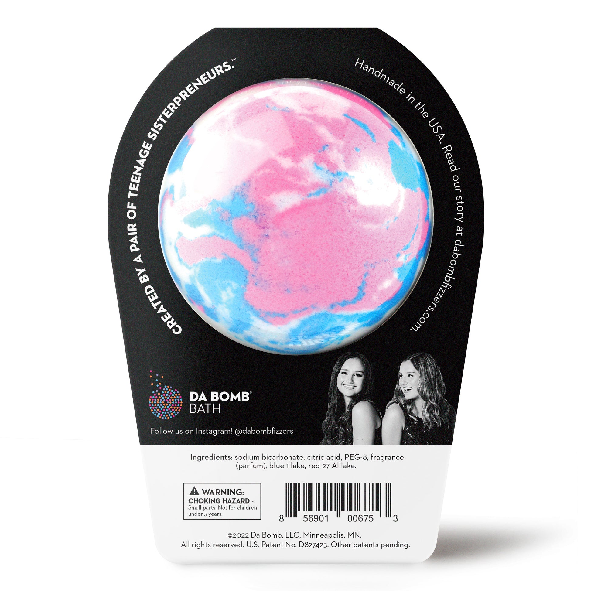 back of a blue, pink and white bath bomb in black packaging 