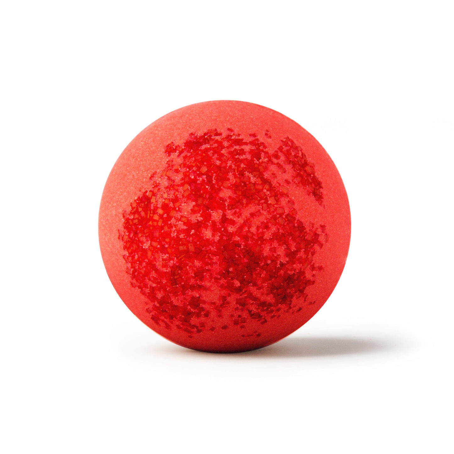 a red bath bomb with sprinkles