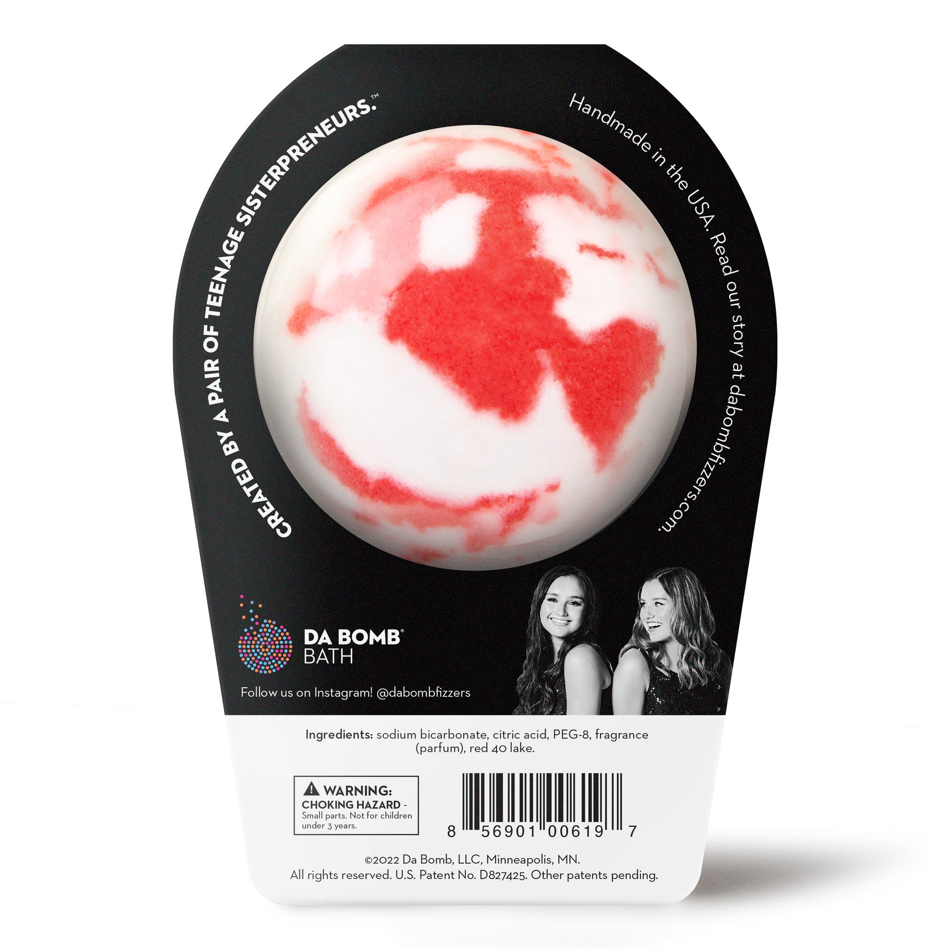back of a red and white bath bomb in black packaging