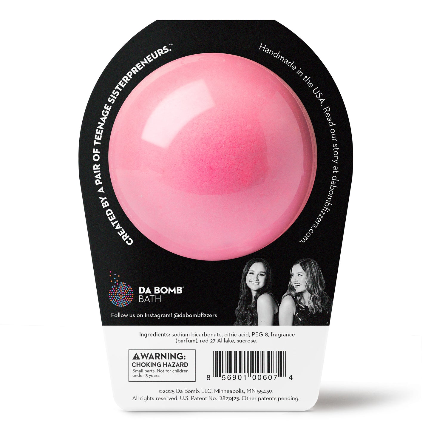 back side of a pink bath bomb in black packaging