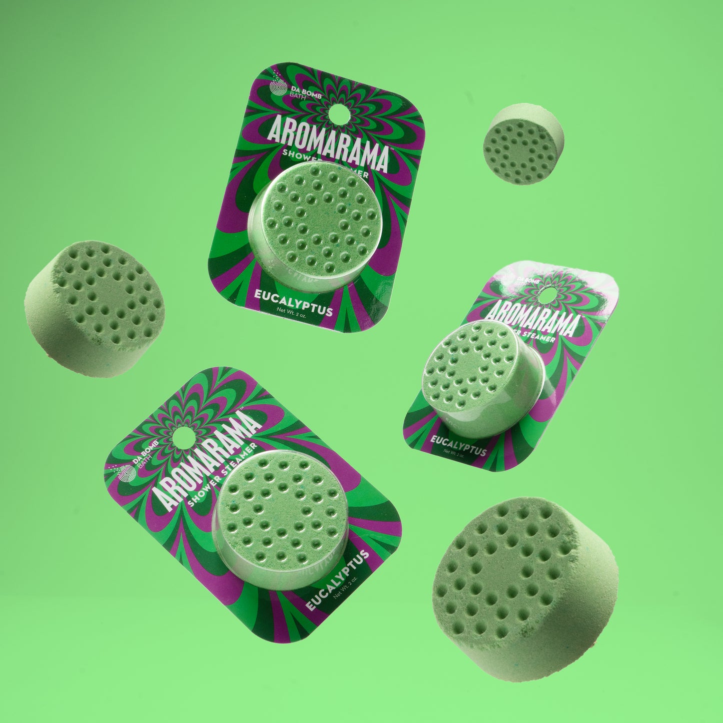3 packaged showers steamers floating in air with green background