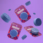 3 packaged showers steamers floating in air with purple background