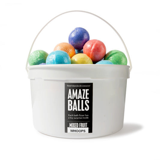 Purple, yellow, red, orange, green, and blue mini bath bombs in a white pail