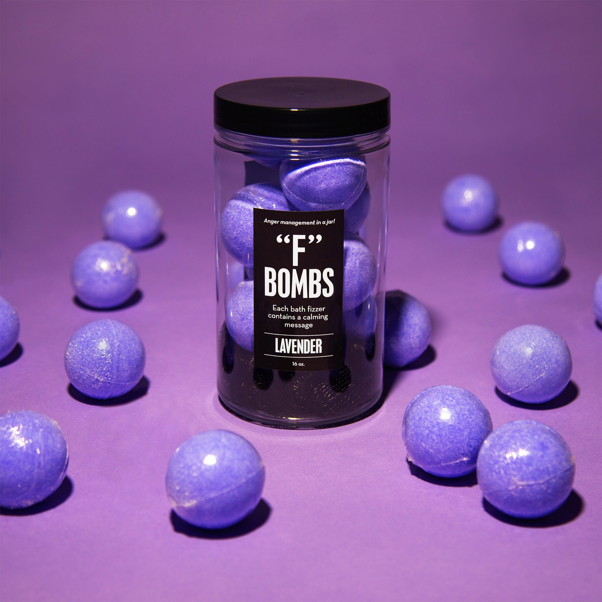 Close up of "F' Bombs bath bombs jar with purple background