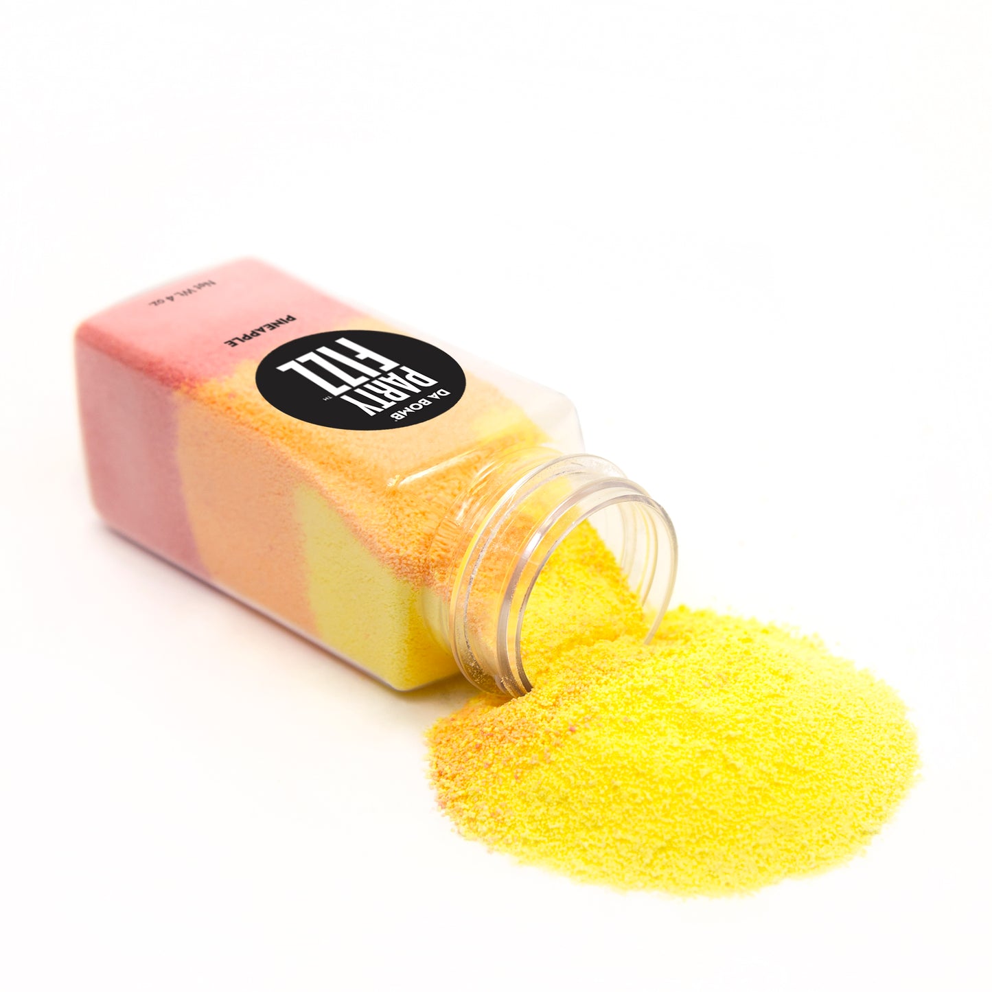 Clear mini jar with yellow, red and orange fizz spilling out of it onto a white background.