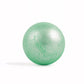Sparkly green, round bath bomb out of packaging on white background.